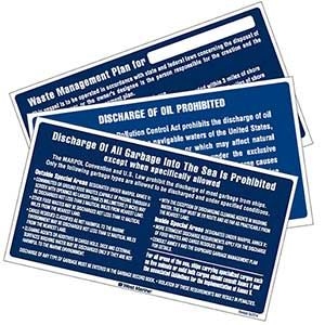 Three Blue And White Signs That Say Discharge Of Oil Prohibited To